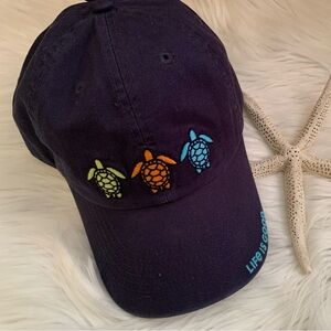 LIFE IS GOOD embroided “Tres turtles” dark blue cotton adjustable closure NWT